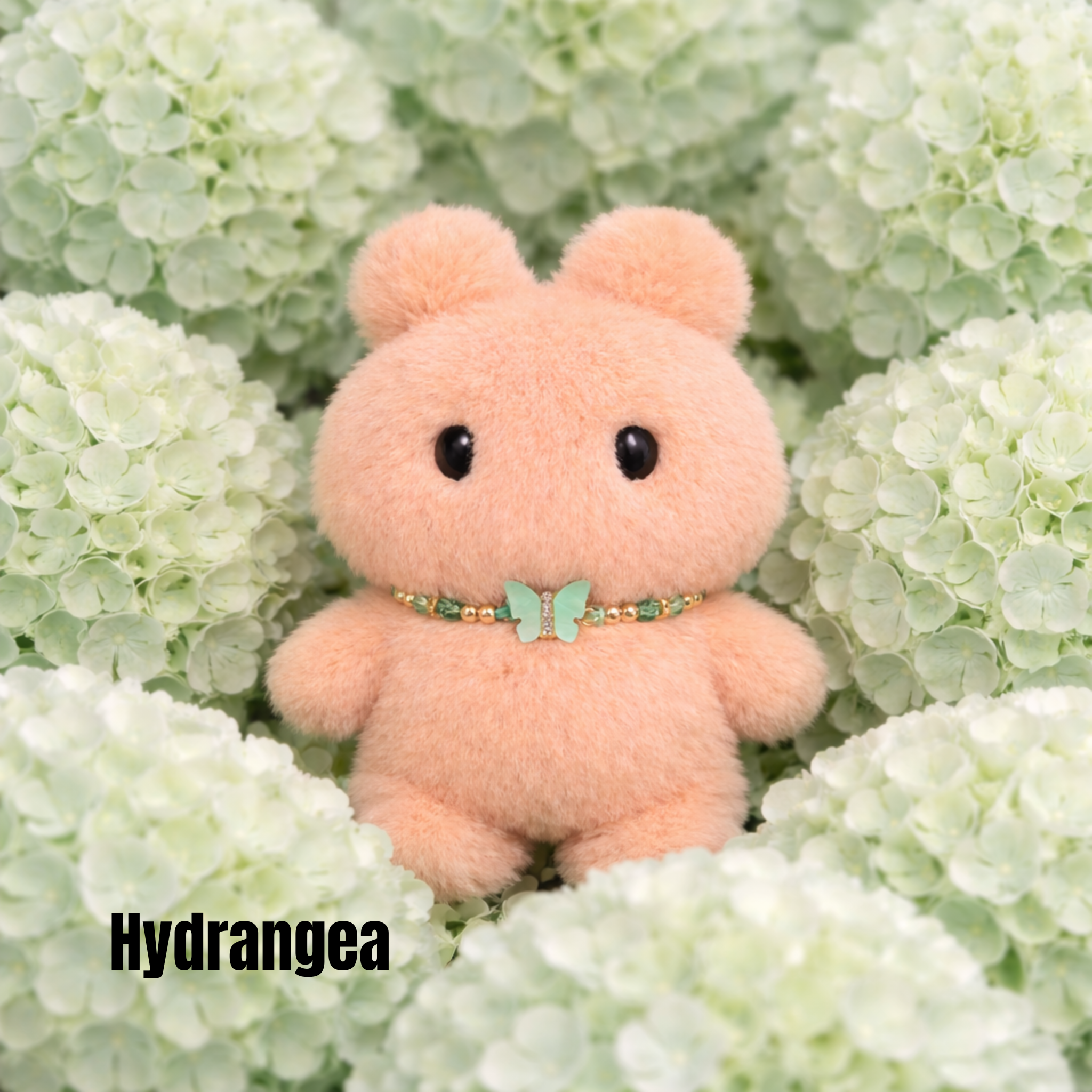 Plush pendant with 'Hydrangea' name tag among light green hydrangea flowers