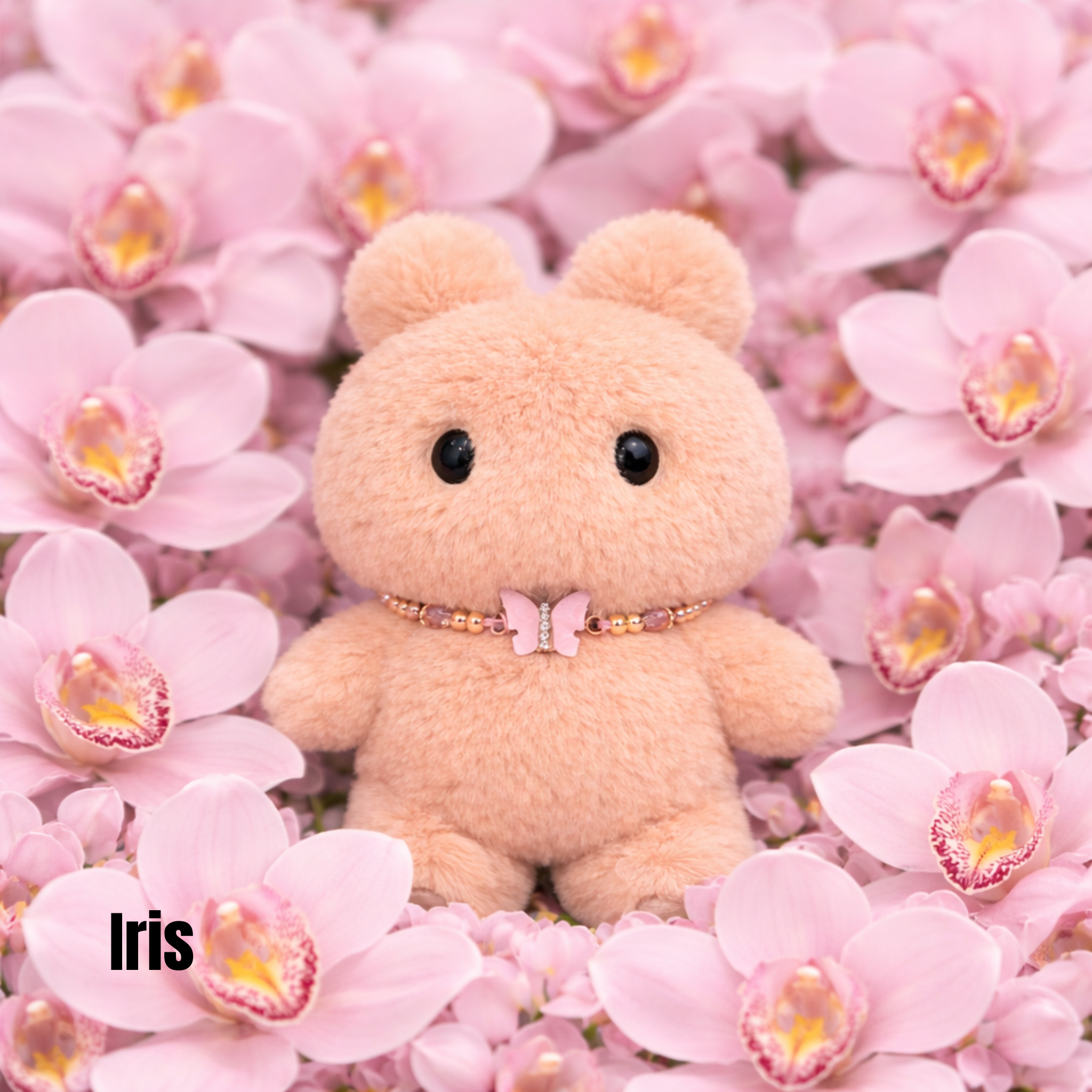 Plush pendant with 'Iris' name tag among light pink orchid flowers