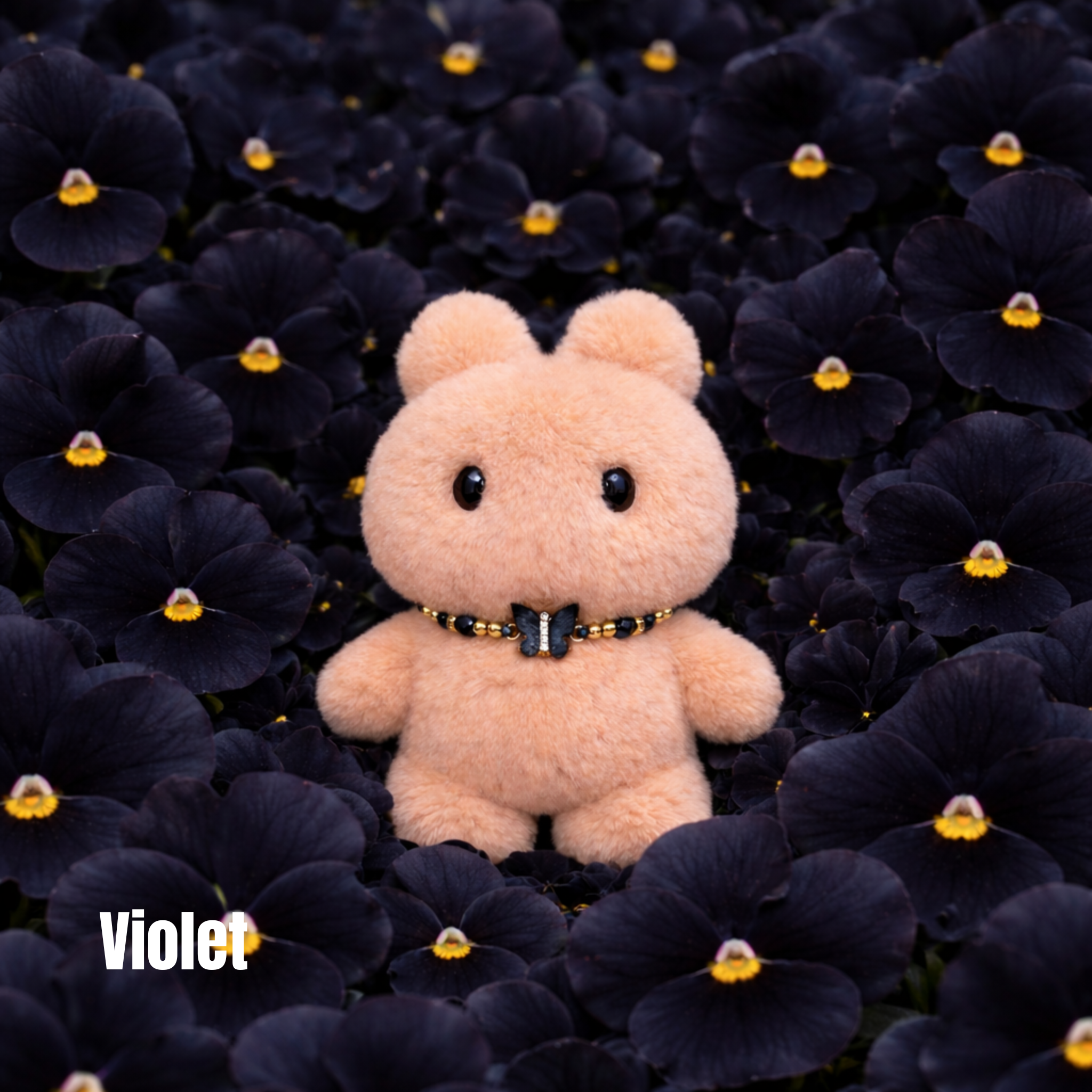 Plush pendant with 'Violet' name tag among black flowers